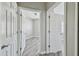 Hallway features views into bedrooms and neutral walls at 6447 Cypressdale Dr # 202, Riverview, FL 33578