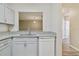 Modern kitchen with gray cabinets, granite countertops, and updated appliances at 6447 Cypressdale Dr # 202, Riverview, FL 33578