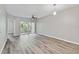 Well-lit living room with sliding glass doors leading to a balcony at 6447 Cypressdale Dr # 202, Riverview, FL 33578