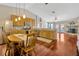 Open-concept kitchen with wooden cabinetry, modern appliances, and a dining area with a fireplace at 703 June Lake Ln, Brandon, FL 33510
