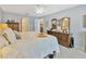 Comfortable bedroom with view of ensuite bathroom and dining area, and soft, neutral decor at 703 June Lake Ln, Brandon, FL 33510