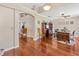 Spacious home office featuring hardwood floors, natural light, and a classic wooden desk at 703 June Lake Ln, Brandon, FL 33510
