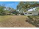 The backyard features a storage shed and a swing at 7143 Sealawn Dr, Spring Hill, FL 34606