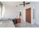 Bedroom features a ceiling fan and hard floors with small night stand at 7143 Sealawn Dr, Spring Hill, FL 34606