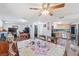 Open-concept dining room with a table and chairs that leads to the kitchen and living room areas at 7143 Sealawn Dr, Spring Hill, FL 34606