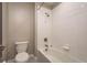 Bright bathroom featuring white tiled walls, a shower over the tub, and white fixtures at 8766 Capstone Ranch Dr, New Port Richey, FL 34655