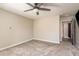 Neutral bedroom featuring a ceiling fan and access to the other rooms in the house at 8766 Capstone Ranch Dr, New Port Richey, FL 34655