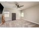 Neutral bedroom with a ceiling fan, and two windows allowing ample natural light at 8766 Capstone Ranch Dr, New Port Richey, FL 34655