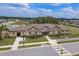 Exterior shot of the clubhouse and pool for the community, with lake in the distance at 8766 Capstone Ranch Dr, New Port Richey, FL 34655