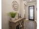 Entryway with stylish decor, console table, and a view into the home at 8766 Capstone Ranch Dr, New Port Richey, FL 34655