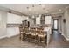 Open-plan kitchen featuring a marble island with seating, stainless steel appliances, and pendant lighting at 8766 Capstone Ranch Dr, New Port Richey, FL 34655