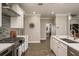 View of kitchen featuring stainless appliances, tile backsplash and access to other rooms at 8766 Capstone Ranch Dr, New Port Richey, FL 34655
