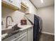 Well organized laundry room featuring new washer and dryer and marble countertops at 8766 Capstone Ranch Dr, New Port Richey, FL 34655