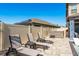 A backyard showing a hot tub and lounge chairs beside a pool with a modern design and outdoor shower at 8766 Capstone Ranch Dr, New Port Richey, FL 34655