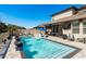 A beautiful backyard pool with a covered patio and in-pool loungers for relaxation at 8766 Capstone Ranch Dr, New Port Richey, FL 34655