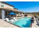 Inviting backyard pool area features lounge seating, a nearby hot tub, and covered patio at 8766 Capstone Ranch Dr, New Port Richey, FL 34655