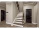 Stylish staircase featuring hardwood treads, modern railing, and neutral wall colors at 8766 Capstone Ranch Dr, New Port Richey, FL 34655