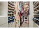 Ample storage is available in this walk-in closet with custom shelving and organization system at 8766 Capstone Ranch Dr, New Port Richey, FL 34655