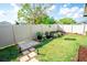 Landscaped backyard with garden beds and lush lawn, perfect for outdoor enjoyment and gardening enthusiasts at 17113 Sunshine Mimosa St, Wimauma, FL 33598