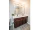 Bathroom featuring a double vanity with quartz countertops, and tiled floors at 17113 Sunshine Mimosa St, Wimauma, FL 33598