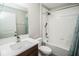 Bathroom featuring a bathtub, shower and sink at 17113 Sunshine Mimosa St, Wimauma, FL 33598