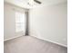 Bedroom with a window, curtain and carpet at 17113 Sunshine Mimosa St, Wimauma, FL 33598