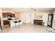 Bright, open kitchen features a center island with seating and stainless steel appliances at 17113 Sunshine Mimosa St, Wimauma, FL 33598