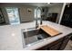 Kitchen sink with stainless steel faucet and countertop island at 17113 Sunshine Mimosa St, Wimauma, FL 33598