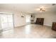 Spacious living room with tile floors, natural light, and ample room for entertaining at 17113 Sunshine Mimosa St, Wimauma, FL 33598