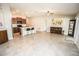 Open floorplan featuring the living, dining, and kitchen areas at 17113 Sunshine Mimosa St, Wimauma, FL 33598
