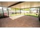 Spacious screened patio with brick pavers, offering a relaxing outdoor living space and views of the landscaped backyard at 17113 Sunshine Mimosa St, Wimauma, FL 33598