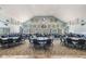 Spacious ballroom or hall with tables and chairs for events, featuring ample natural light at 10216 Moshie Ln, San Antonio, FL 33576