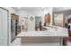Bright kitchen features stainless steel appliances, light countertops, and ample cabinet space at 10216 Moshie Ln, San Antonio, FL 33576