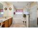 Bright bathroom with double vanity, soaking tub, glass enclosed shower, and a neutral color palette at 10216 Moshie Ln, San Antonio, FL 33576