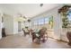 Enclosed sunroom with plenty of natural light, perfect for relaxing and enjoying the outdoors at 10216 Moshie Ln, San Antonio, FL 33576