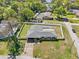 Aerial view of a home showcasing the fenced backyard and surrounding neighborhood at 1110 S Pine Lake Dr, Tampa, FL 33612