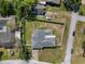 Overhead shot of the property highlighting its spacious yard, fenced perimeter, and neighborhood setting at 1110 S Pine Lake Dr, Tampa, FL 33612