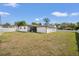 Spacious backyard with white fencing, perfect for outdoor activities and entertaining at 1110 S Pine Lake Dr, Tampa, FL 33612