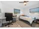 Bedroom featuring lots of natural light, desk, chair and a ceiling fan at 1110 S Pine Lake Dr, Tampa, FL 33612