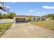 Lovely single-story home with a well-manicured lawn and attached garage at 1110 S Pine Lake Dr, Tampa, FL 33612