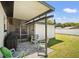 Covered patio area with brick pavers, grill, and seating for relaxing outdoors at 1110 S Pine Lake Dr, Tampa, FL 33612