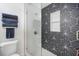 Stylish shower features geometric tile design and a built-in niche at 1110 S Pine Lake Dr, Tampa, FL 33612