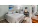 Comfortable bedroom features a soothing paint color, a decorative lamp, and a side table at 1159 Montrose Pl, Dunedin, FL 34698
