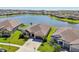 Aerial view of a beautiful home with a lake view at 13822 Carlow Park Dr, Riverview, FL 33579