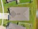 New roof aerial view shows the house with green lawn, landscaping, and proximity to a pond at 13822 Carlow Park Dr, Riverview, FL 33579