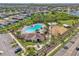 Aerial view of community pool and playground with surrounding green space and clubhouse at 13822 Carlow Park Dr, Riverview, FL 33579