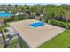 Basketball court surrounded by mature landscaping, seating and black fencing at 13822 Carlow Park Dr, Riverview, FL 33579