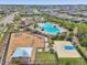 Community with playground, pool, and basketball court, surrounded by houses and mature trees at 13822 Carlow Park Dr, Riverview, FL 33579