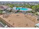 An aerial view of the community playground with swings and a shade structure at 13822 Carlow Park Dr, Riverview, FL 33579