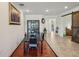 This home offers a modern dining room with wood-look floors and modern lighting, perfect for gatherings and entertaining at 13822 Carlow Park Dr, Riverview, FL 33579